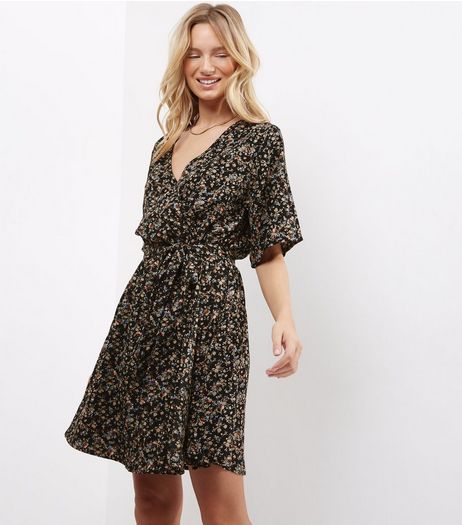Black Ditsy Floral Wrap Front Mini Dress | New Look