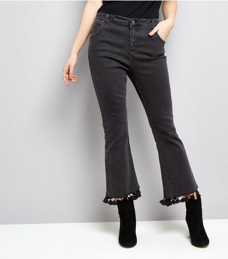 Black Pom Pom Trim Flared hem Jeans | New Look
